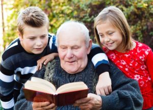 grandfather reading to children