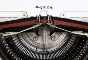 Typewriter with "storytelling" written on paper